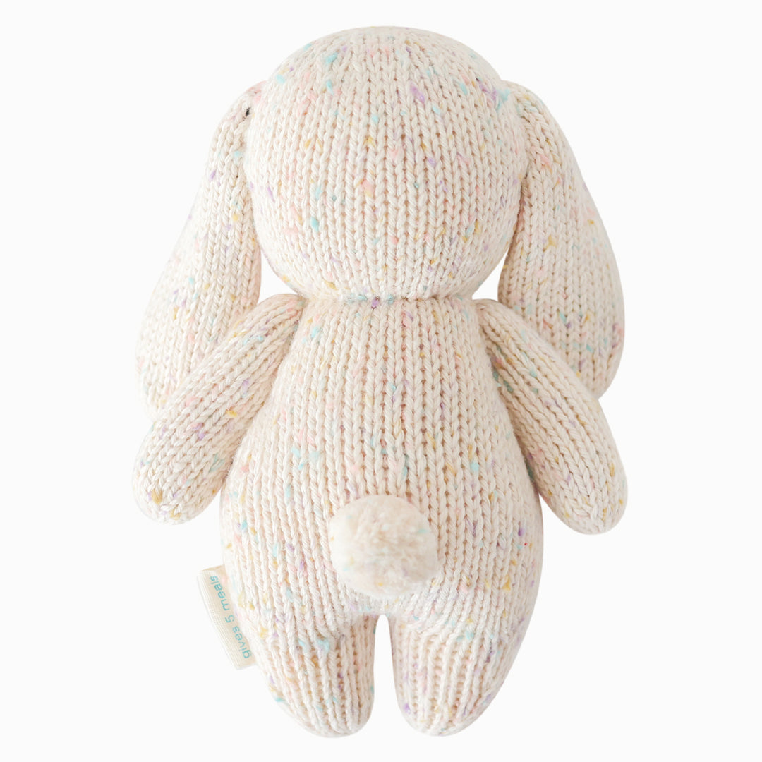 Knitted bunny toy on a white background