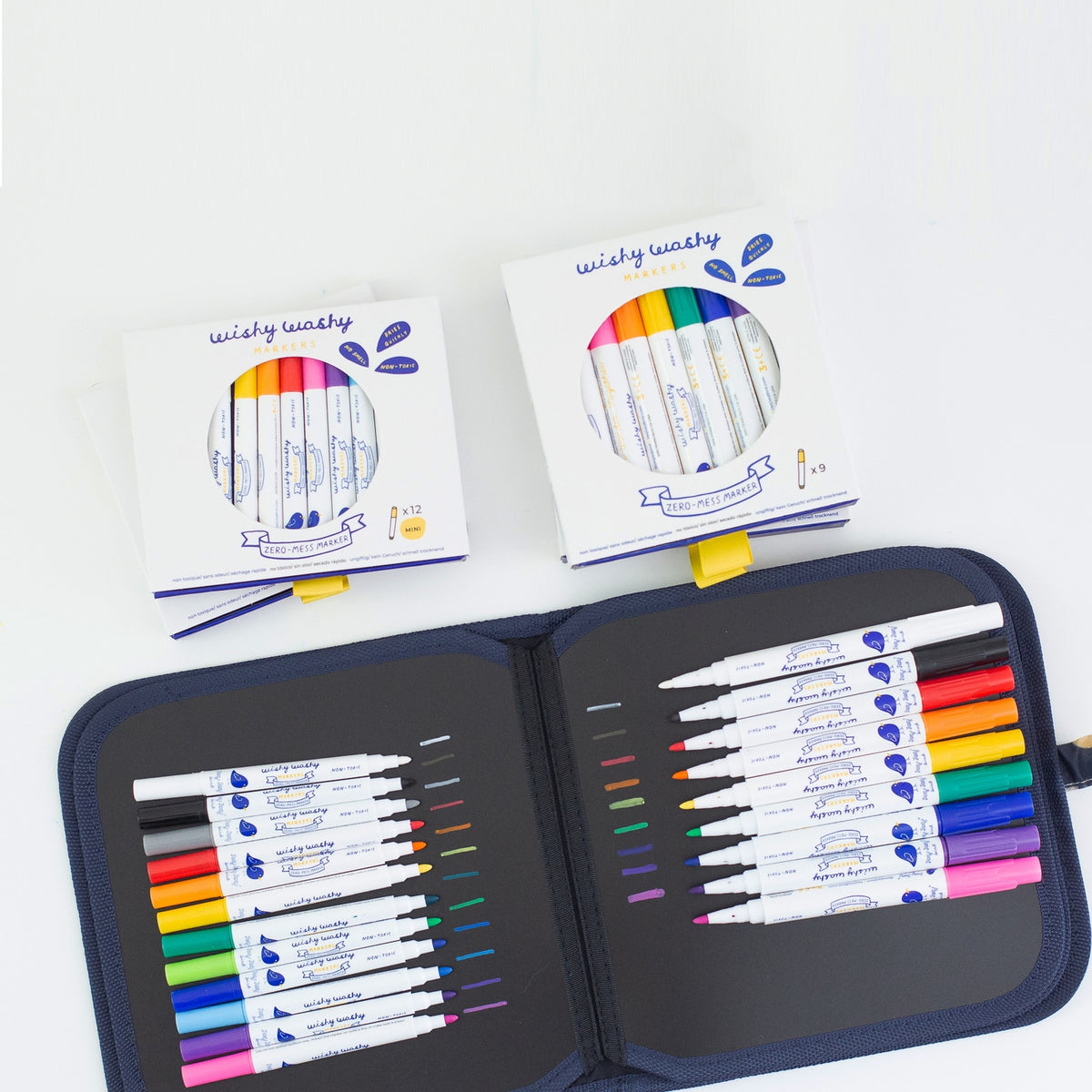 Set of colorful markers in a case with packaging on a white background
