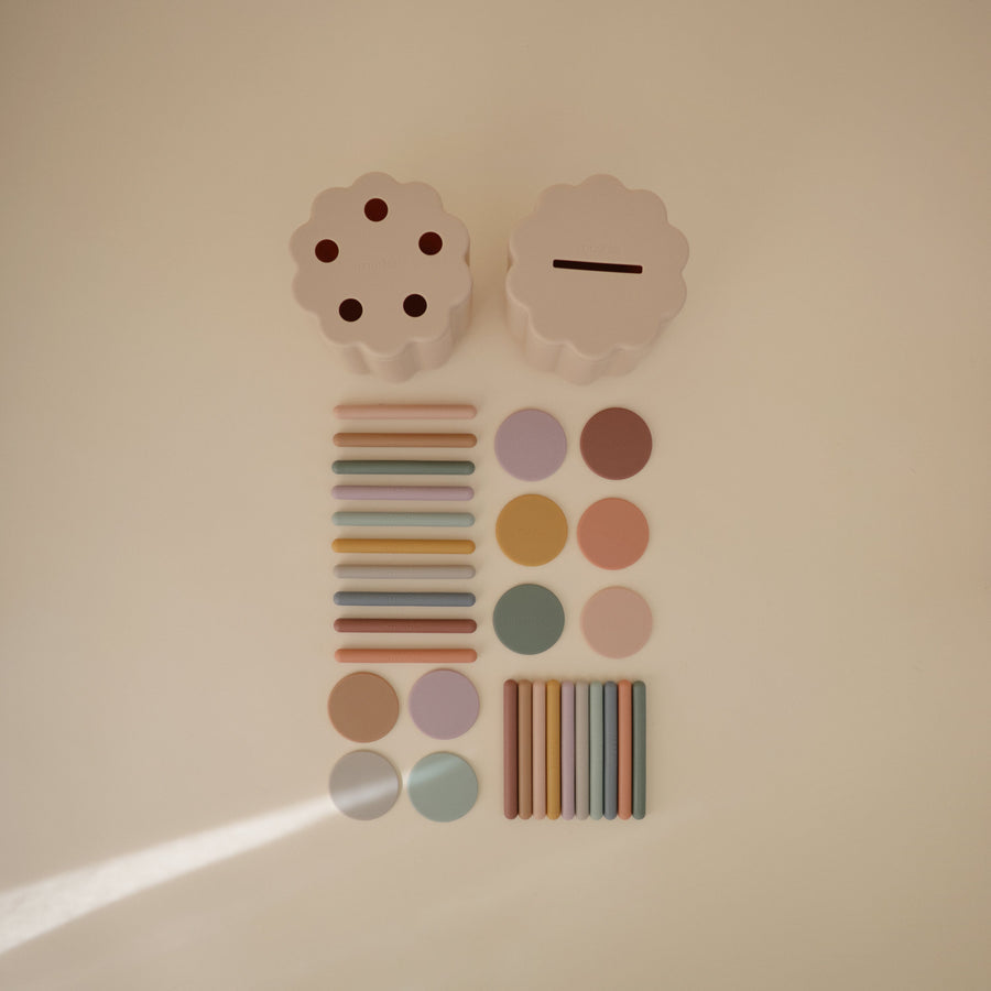 Decorative wall art with colorful circles and rectangular shapes on a beige background