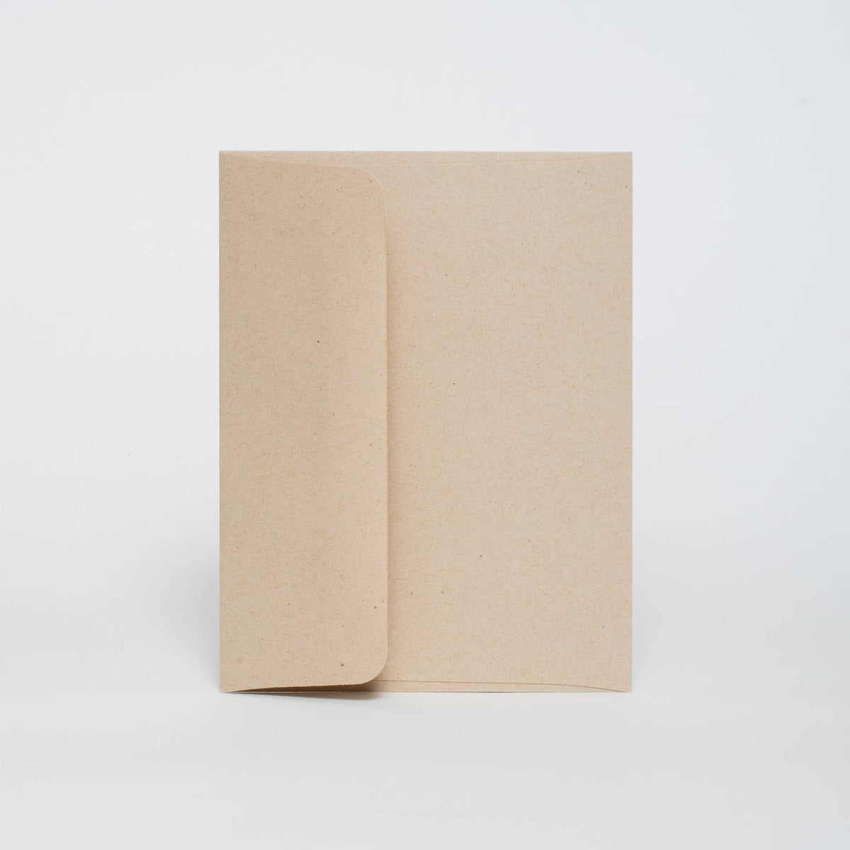 Two beige notebooks on a white background
