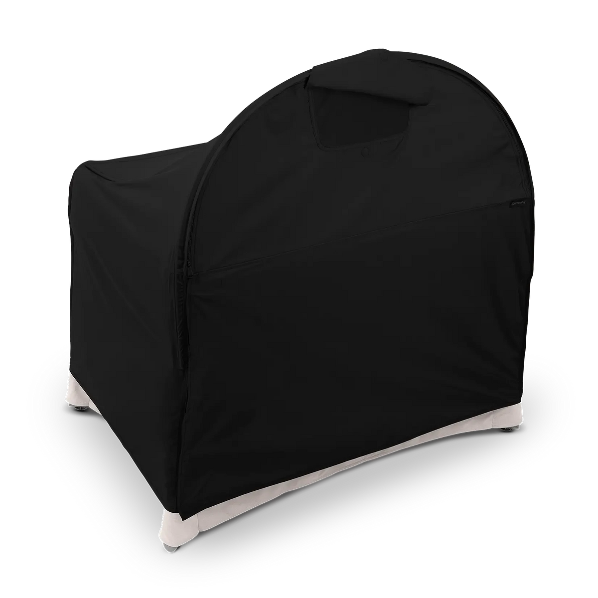 A black room-darkening canopy fitted over an UPPAbaby Remi V2 playard against a dark checkered background.