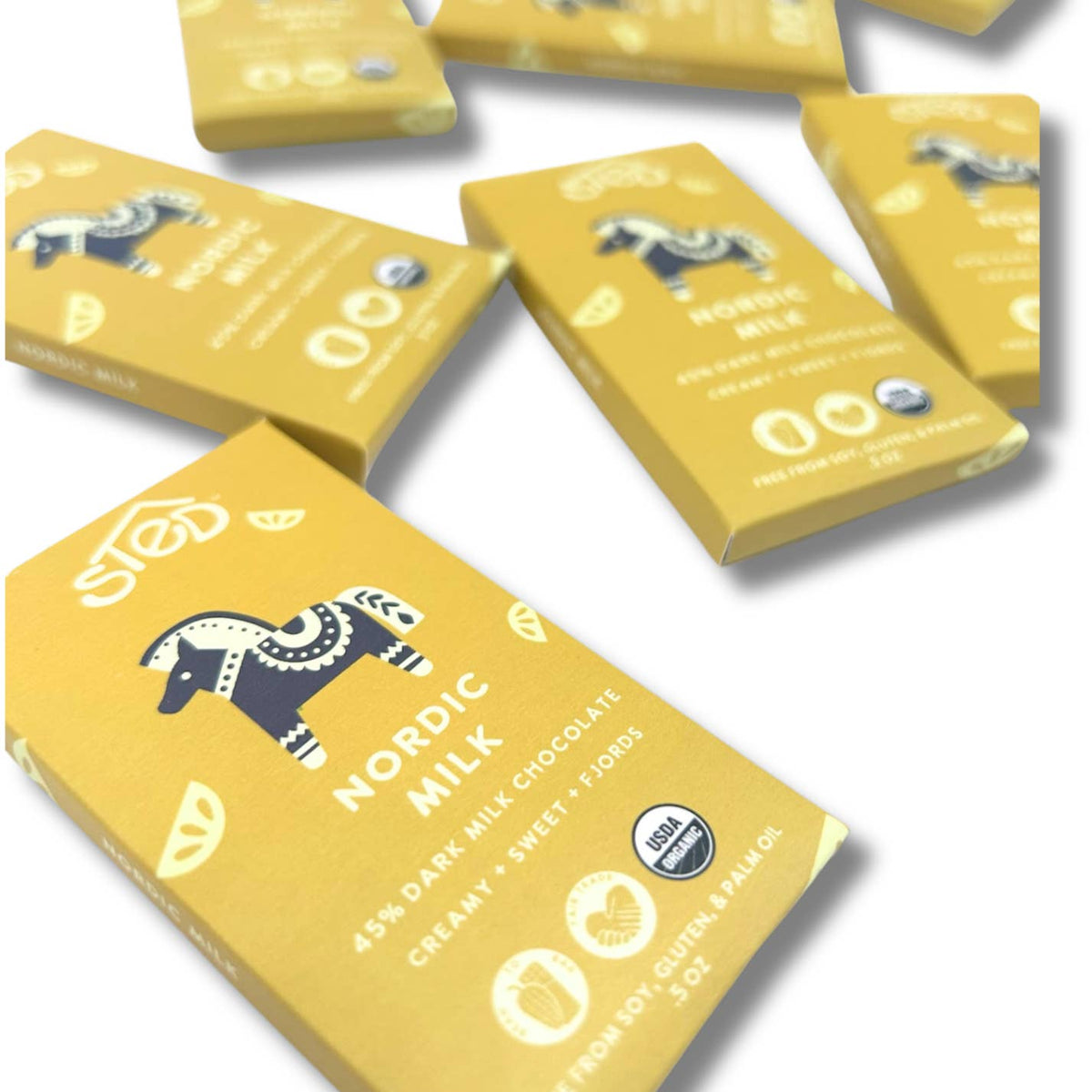 Yellow packaging of Nordic Milk chocolate bars on a white background