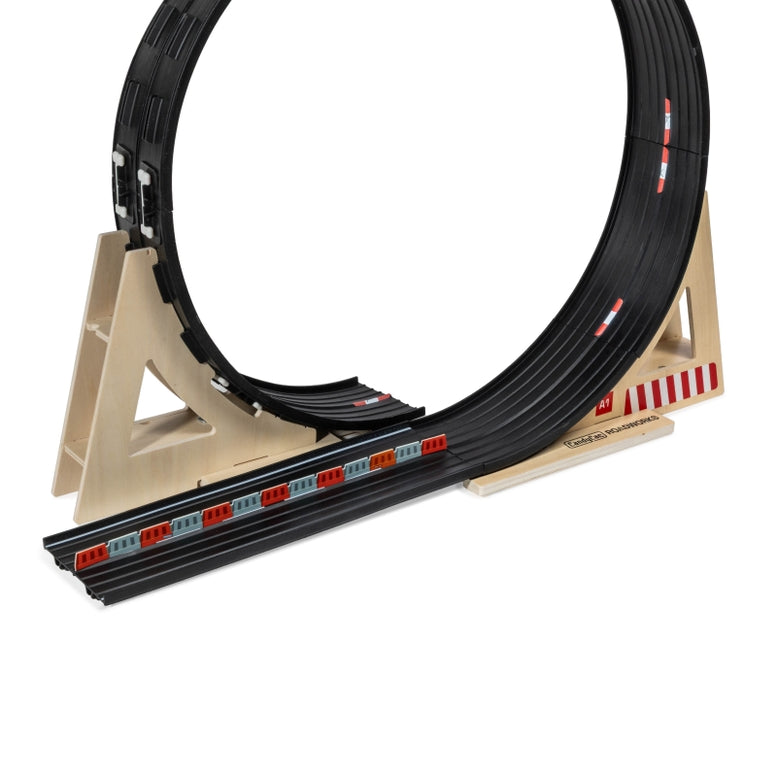 Model race track with circular track and straight sections on a white background