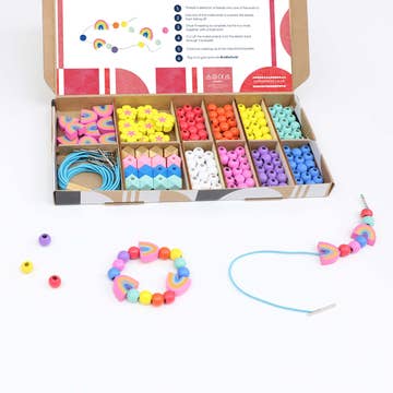 Colorful bead set with packaging on a white background
