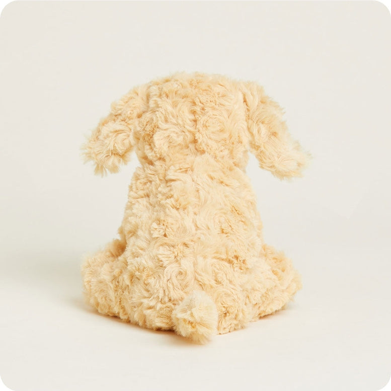 A rear-view perspective of the Golden Dog Junior plush toy by Warmies, displaying its soft, textured cream-colored fur and floppy ears.