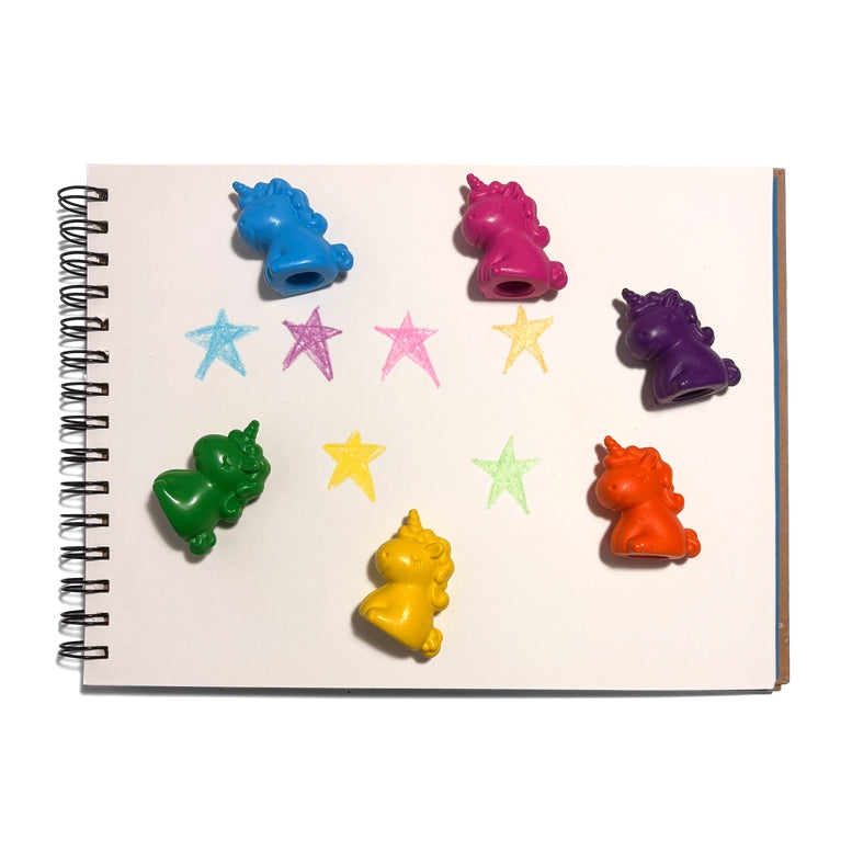 A set of colorful spiral-bound notebook erasers shaped like unicorns and stars, displayed on a white page of a spiral notebook.