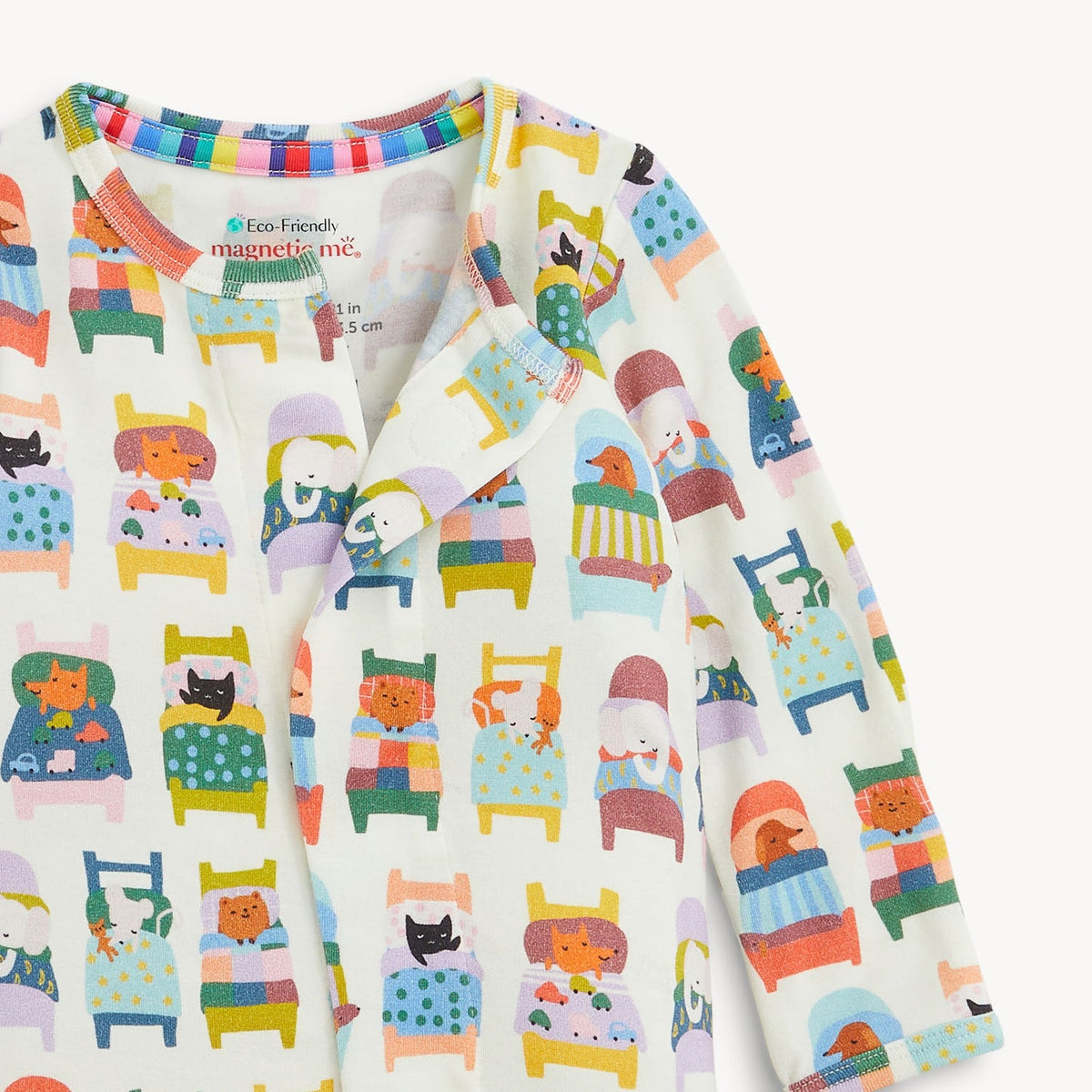 Children's long-sleeve shirt with colorful animal and furniture pattern on a white background