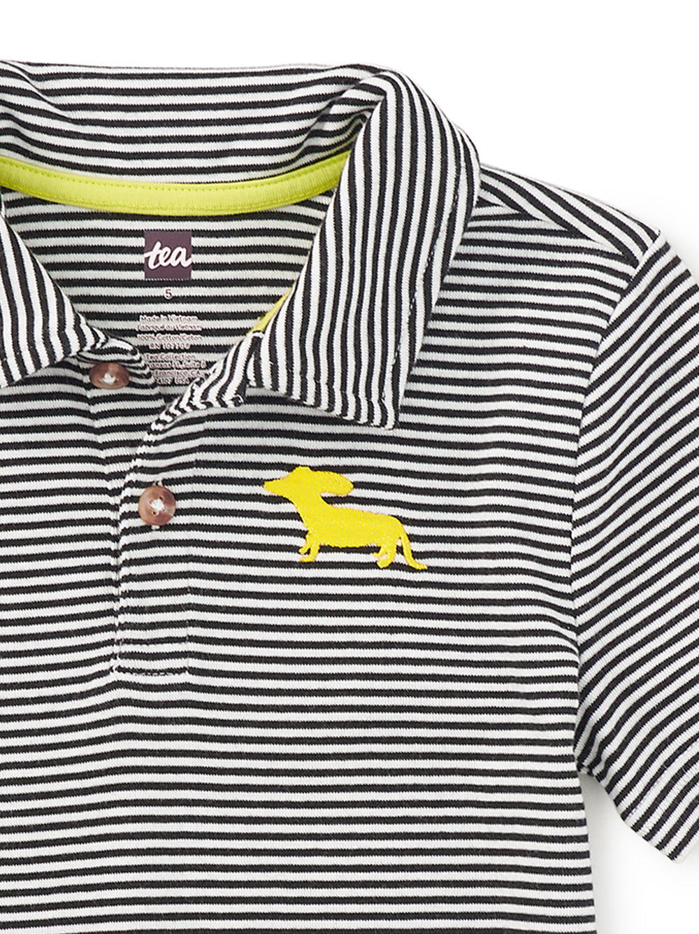Black and white striped polo shirt with yellow dachshund logo on a white background