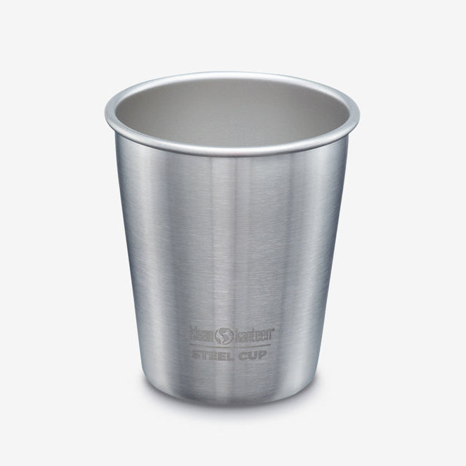 A stainless steel travel cup with a brushed metal finish, featuring the 'Kanso Steel Cup' logo near the base, set against a plain light gray background.