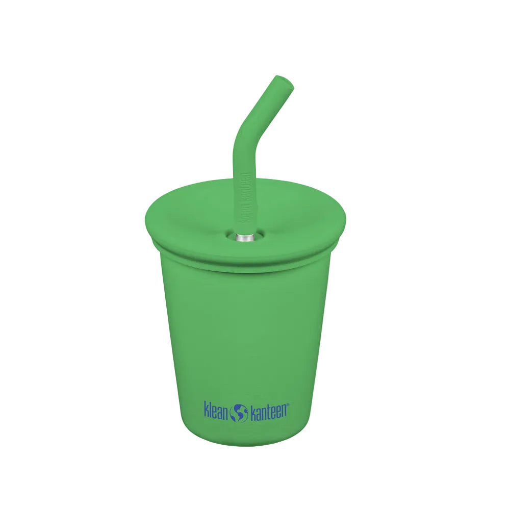 Green tumbler with straw on a white background