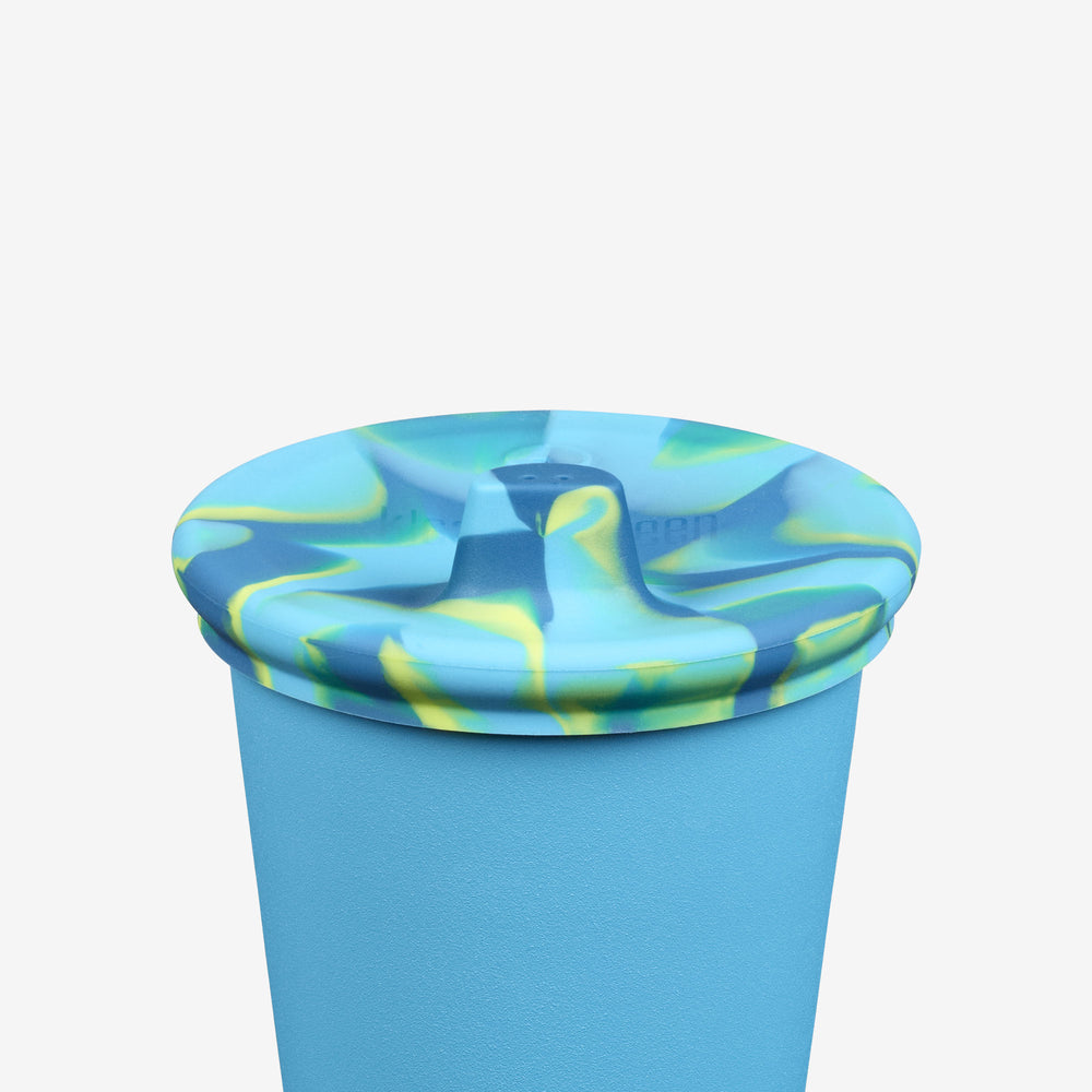 Blue and green marbled cup with lid on a white background