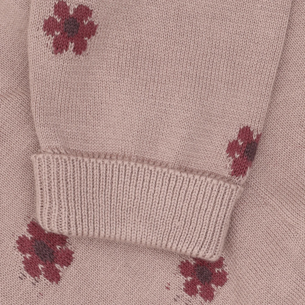 Close-up dusty pink, featuring a small dark red floral print
