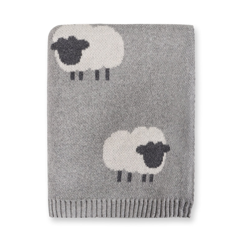 Gray knitted blanket with sheep designs on a white background