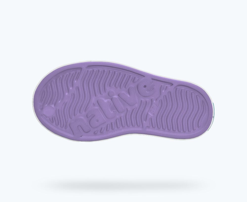 Purple shoe sole with brand logo on a white background