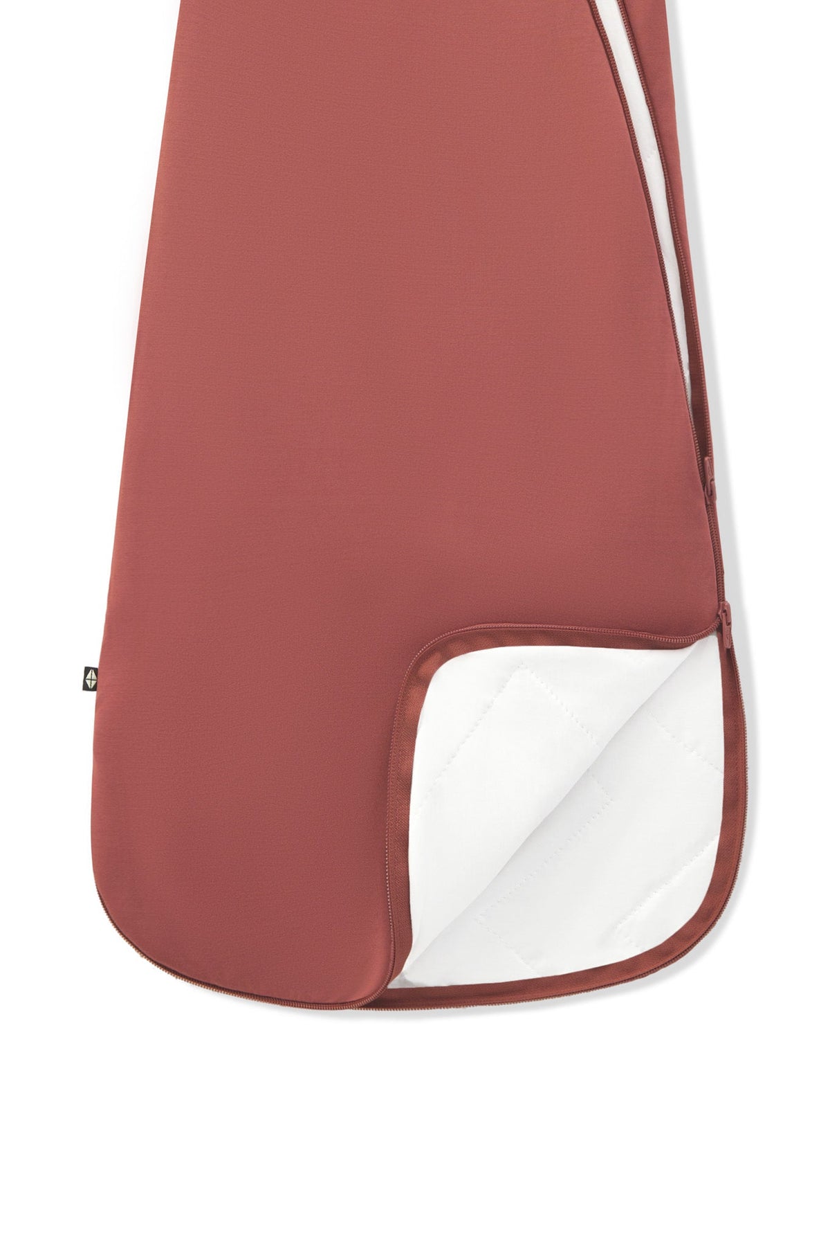A close-up of a terracotta-colored protective cover or sleeve with a white inner lining, shown on a plain white background.