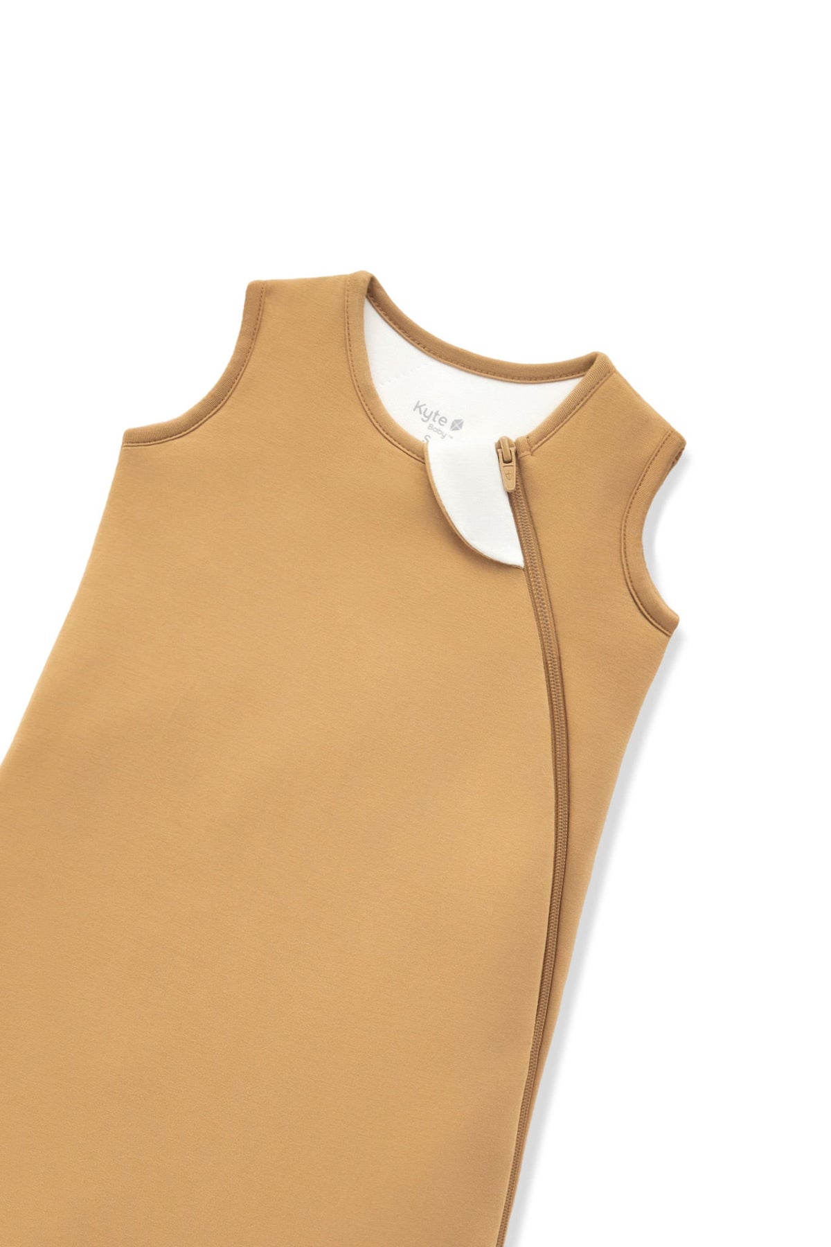 A close-up of a warm camel tan color protective cover or sleeve with zipper, shown on a plain white background.