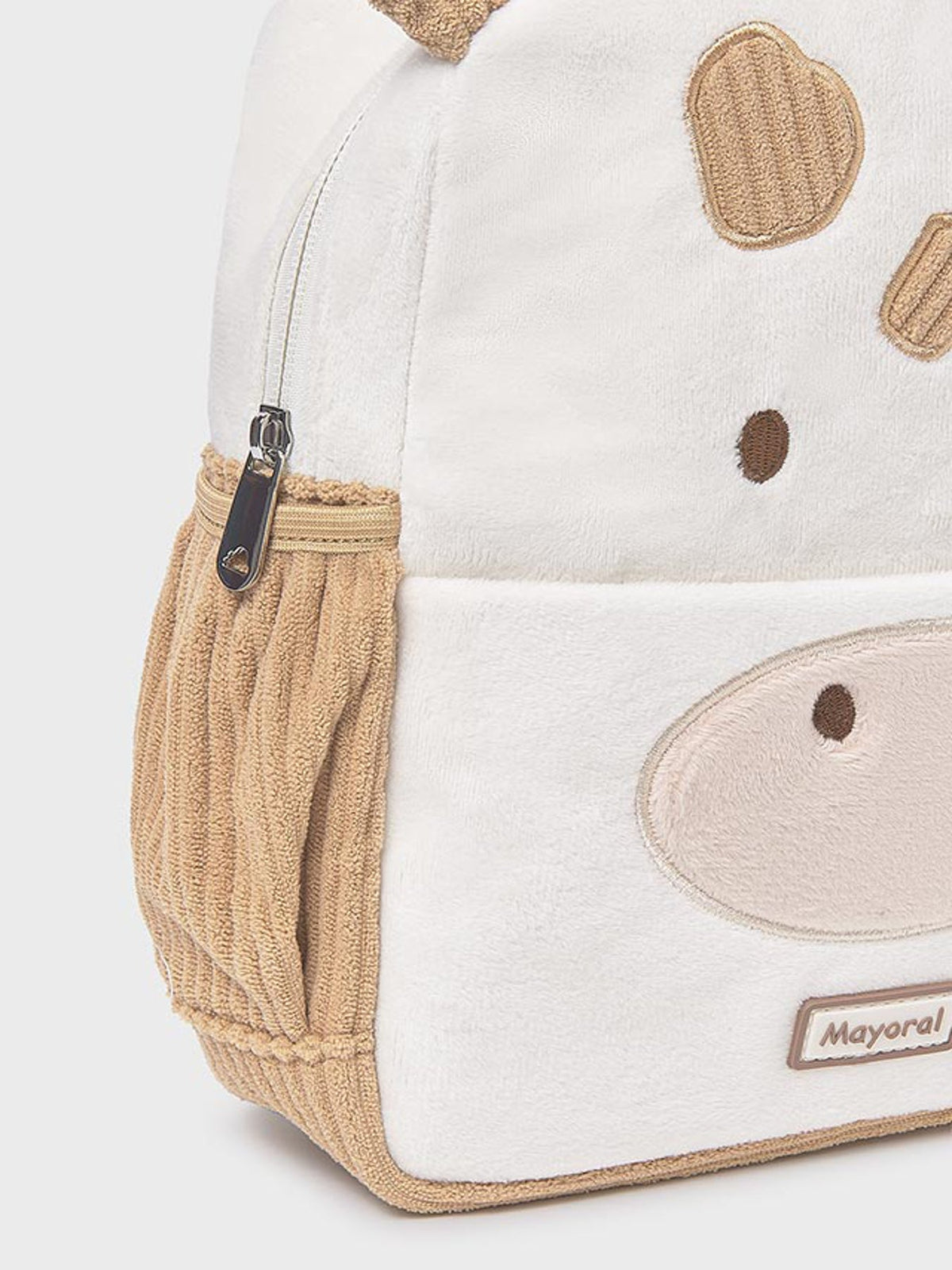 Children's backpack with cow design and visible brand name on a white background