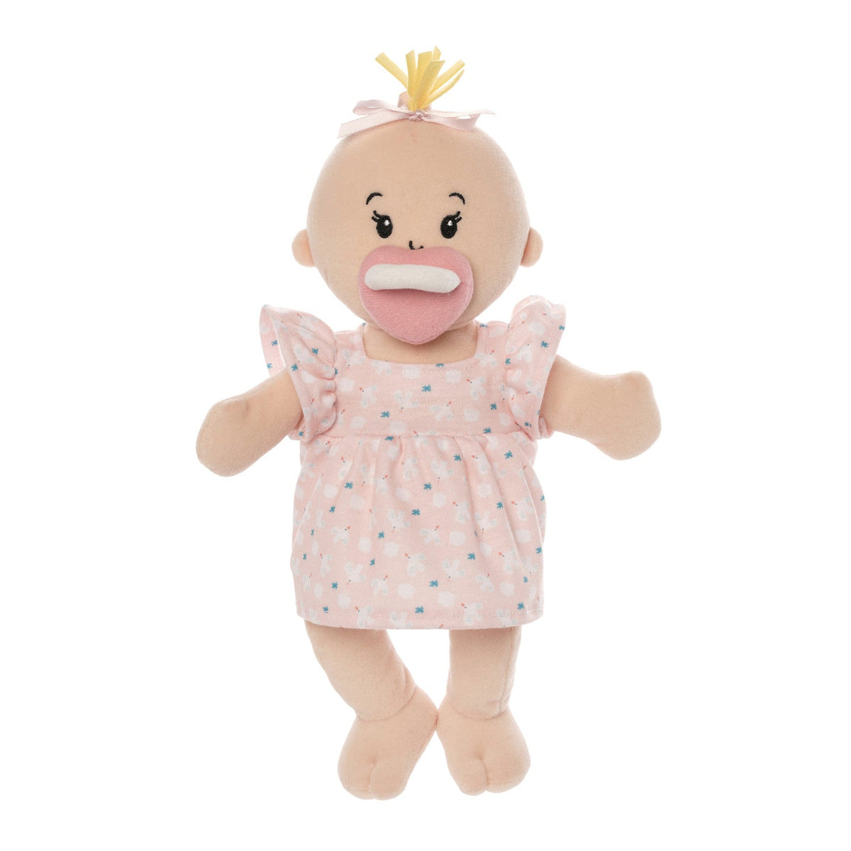 Plush baby doll with a pink dress and yellow crown on a white background