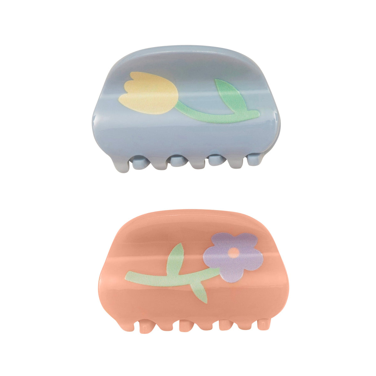 Two hair clips with floral designs on a white background