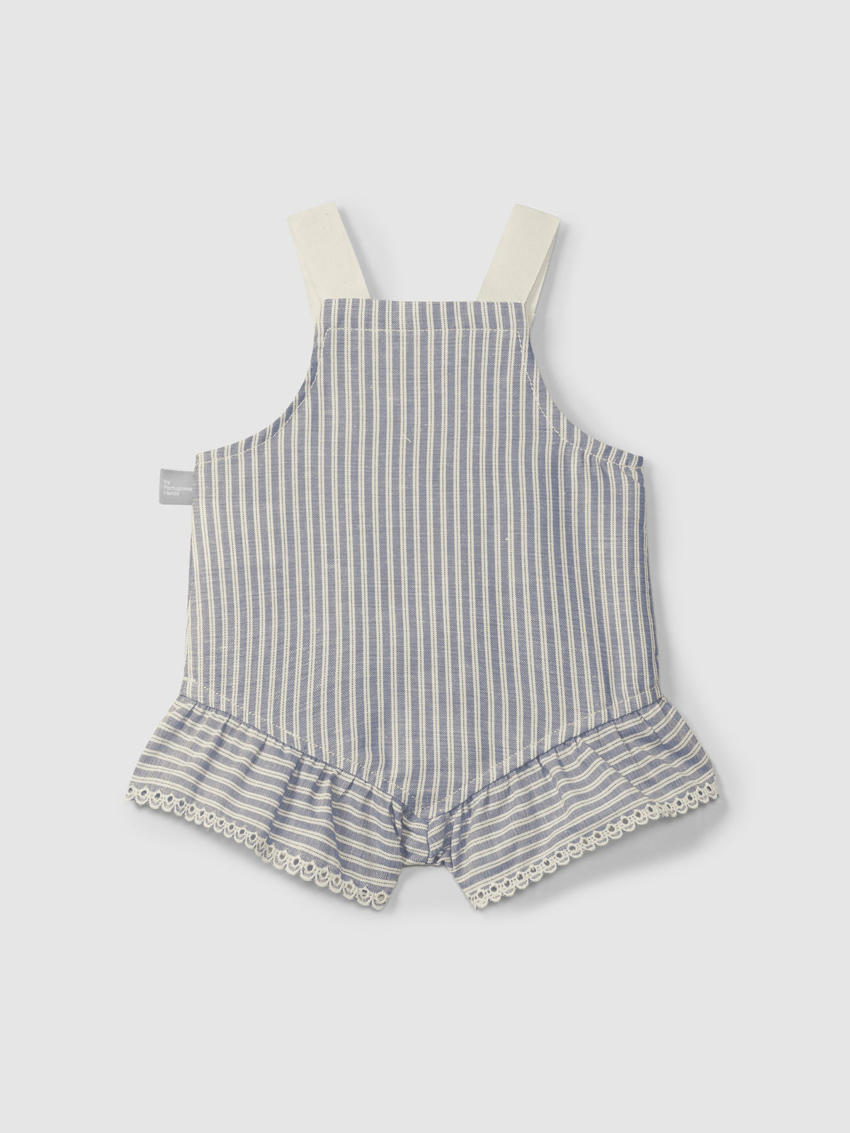 Striped baby romper with ruffled bottom on a light gray background