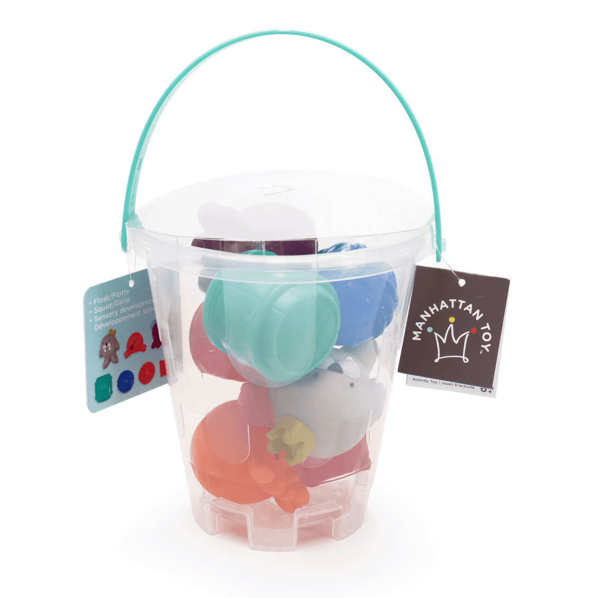 Clear plastic bucket with a turquoise handle holding the Manhattan Toy Mini Mateys bath toy set, featuring tags attached to the side.