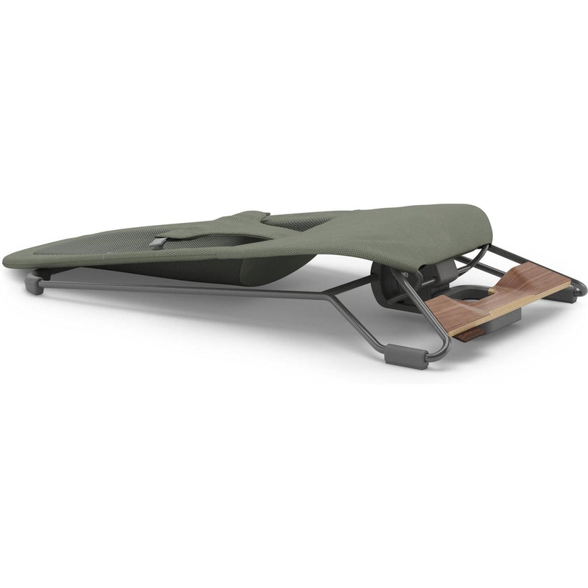 An outdoor camping lounge chair with an olive green fabric seat, a dark gray metal frame, and a wooden footrest, shown on a plain white background.