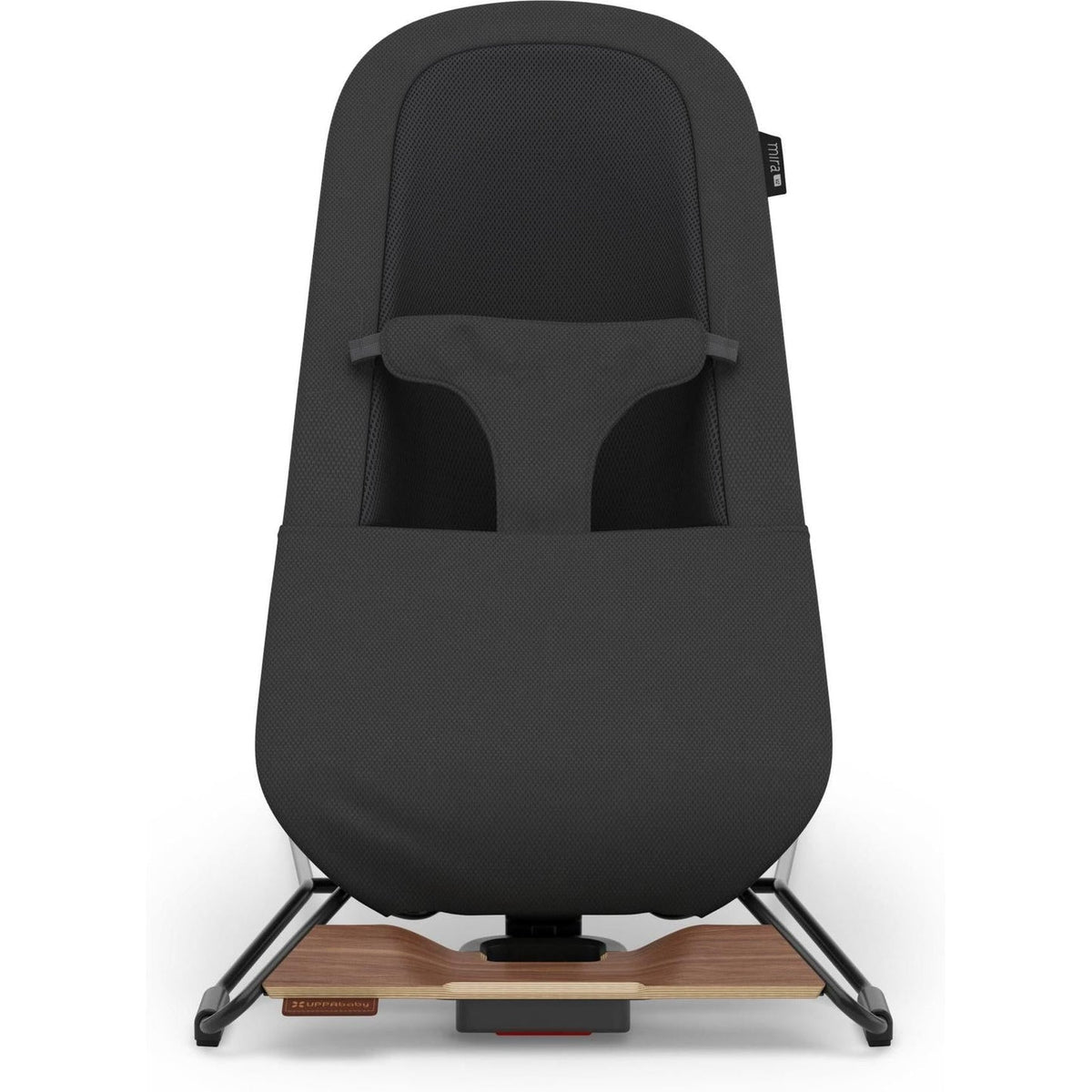 A black baby car seat with a wooden base plate and black metal legs, shown from the front against a white background.