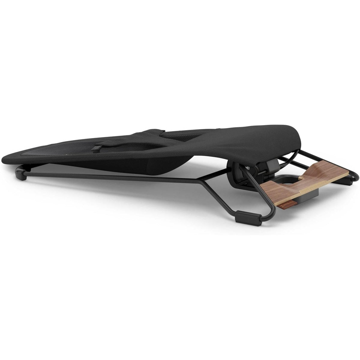 A black padded exercise or massage board with a black metal frame and a light brown wooden footrest, shown on a clean white background.