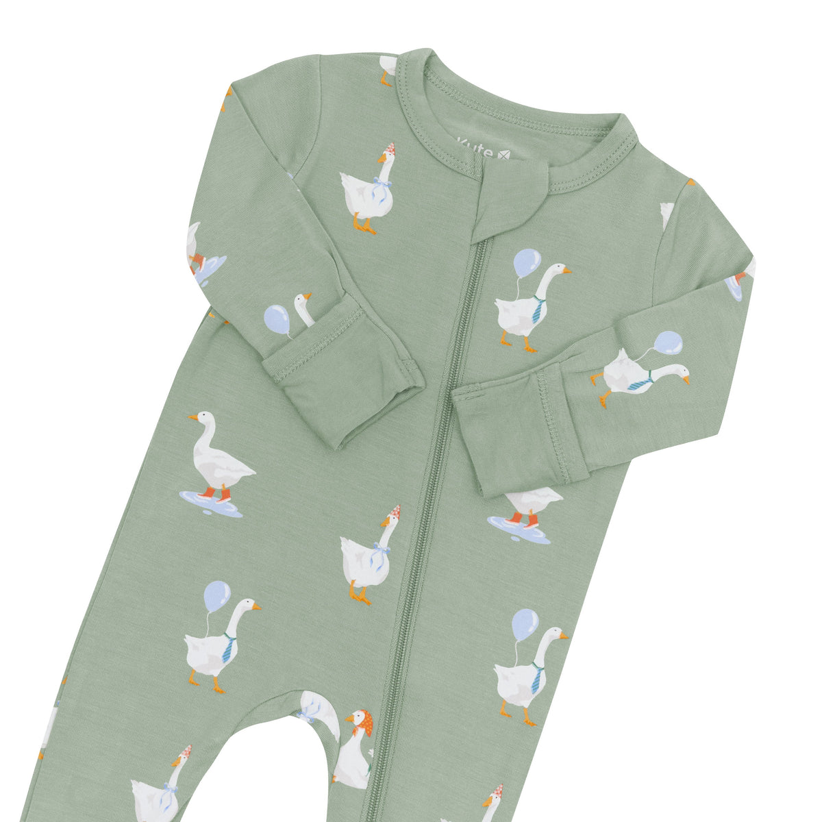 Green baby onesie with goose pattern on a white background