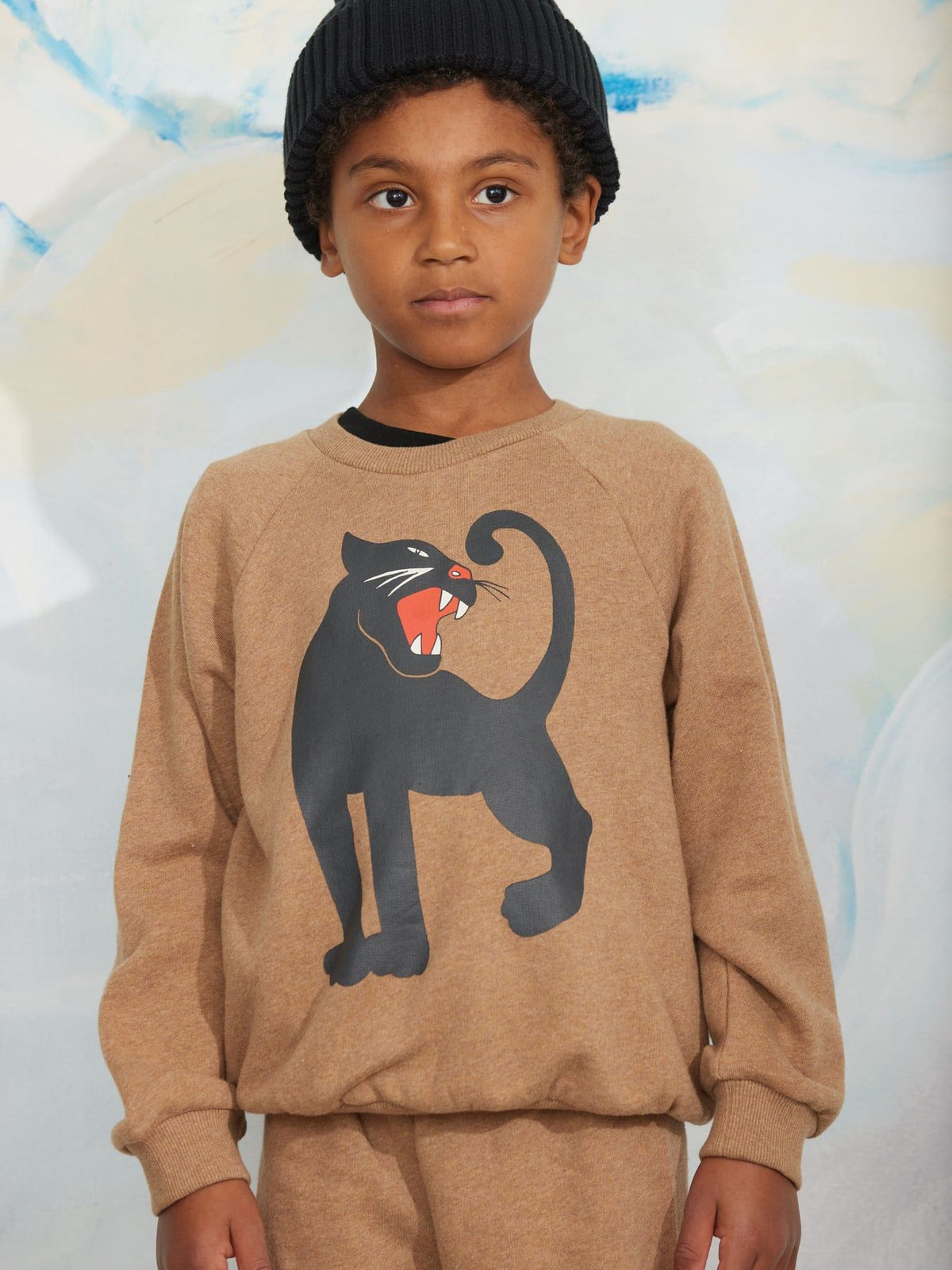 Sweatshirt featuring a large black panther graphic with an orange mouth and white details