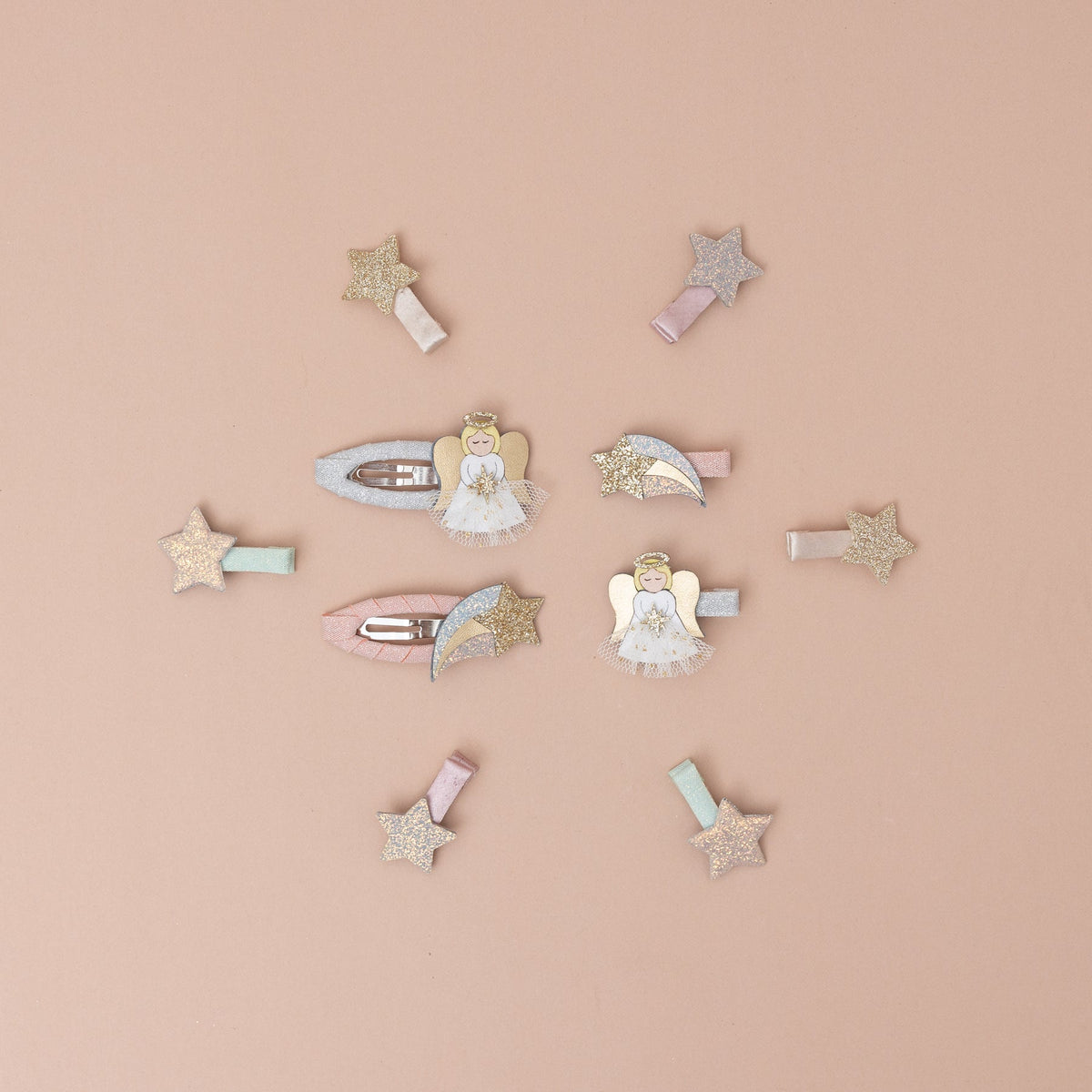 Collection of decorative hair clips on a beige background