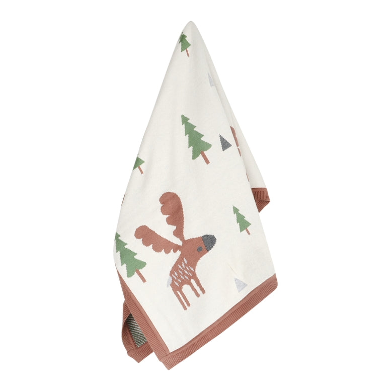 An off-white cotton tea towel with a woodland print featuring a brown moose and green pine trees, finished with a rust-brown ribbed border.