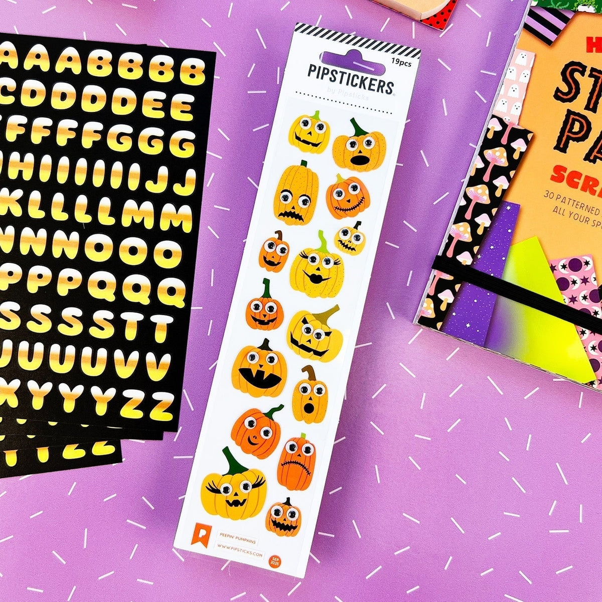 Halloween-themed sticker sheets on a purple background with white lines