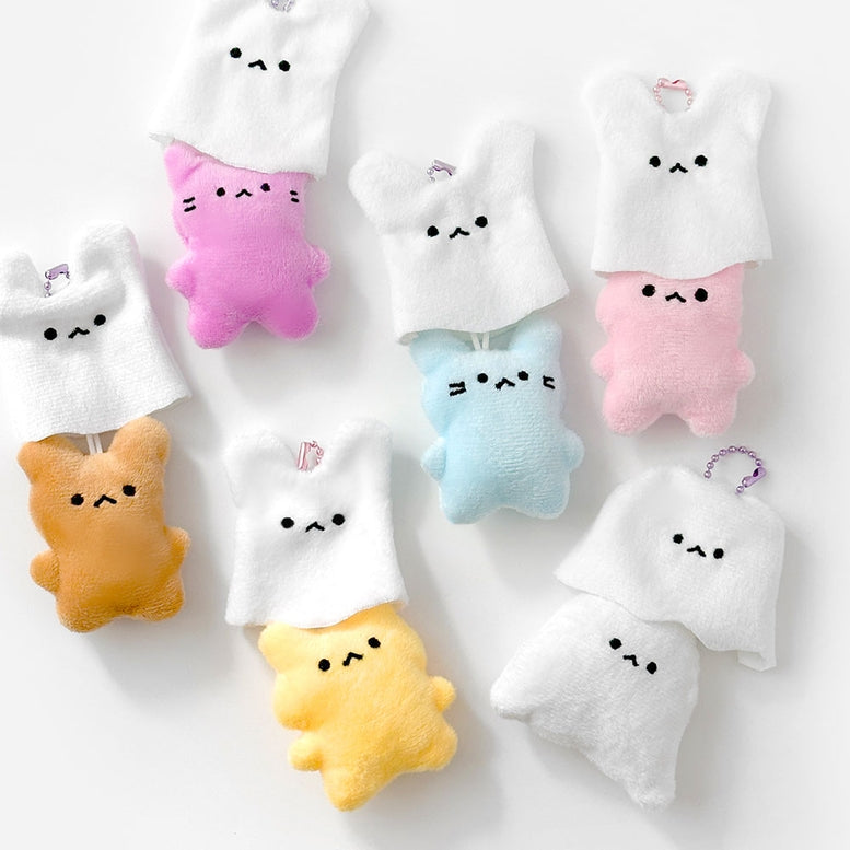 Set of cute plush toys with various colors on a white background