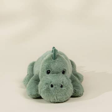 A small plush dinosaur toy in a light mint green color, photographed against a plain off-white background.