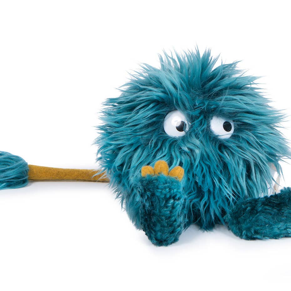 Blue plush toy with googly eyes on a white background