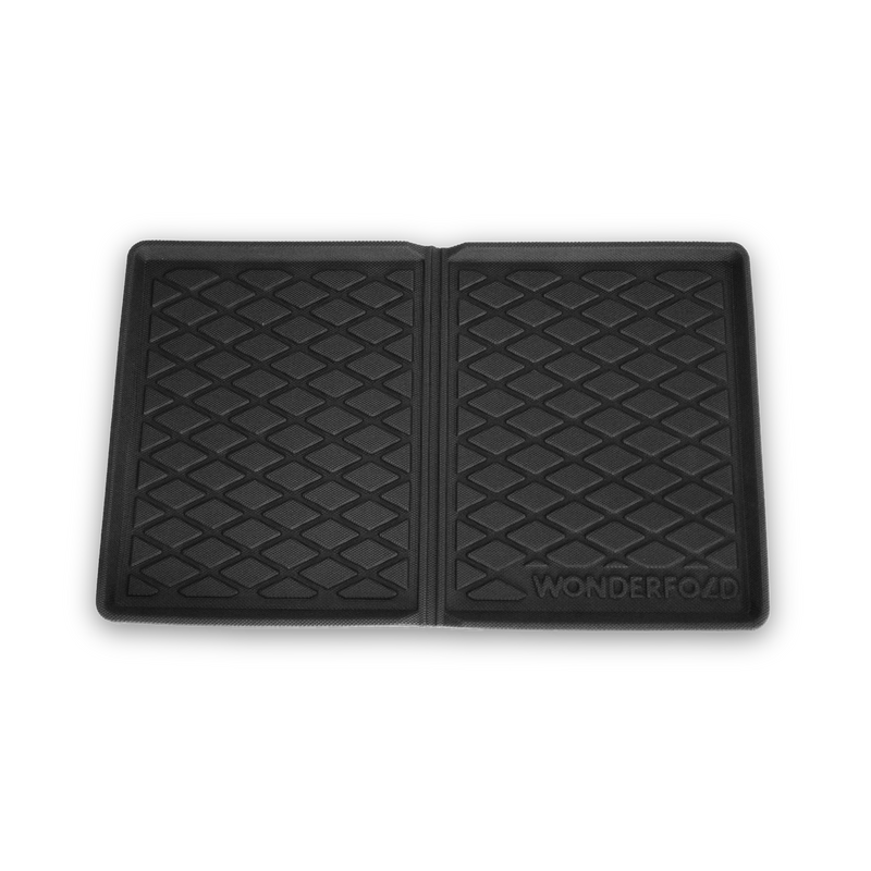 Black car mat with diamond pattern on a white background