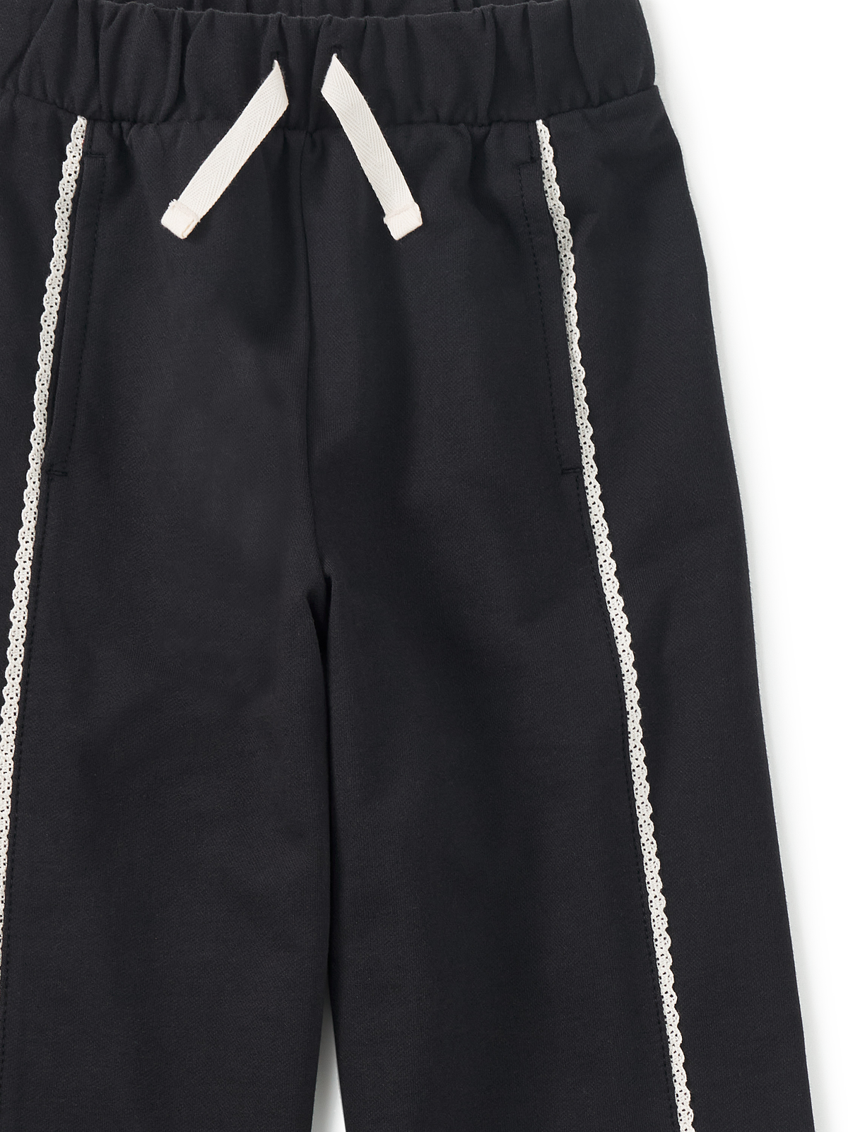 Black pants with white drawstrings and side stripes on a white background