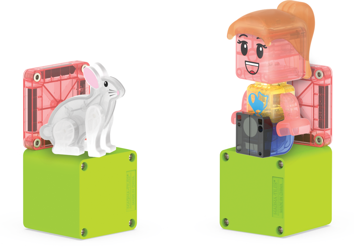 Toy figure of a girl with a rabbit on a white background