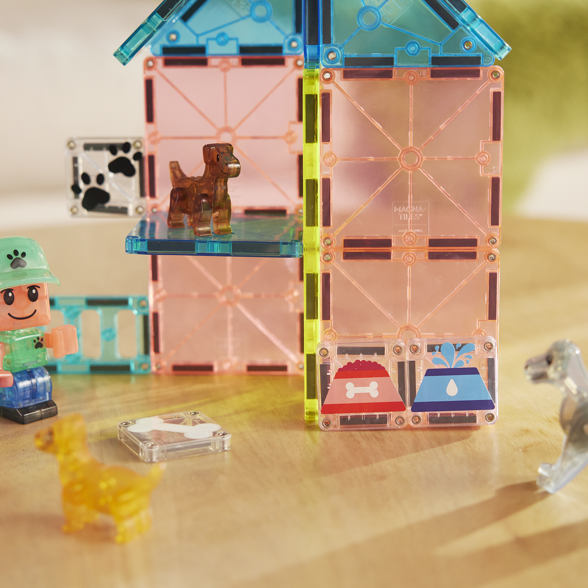 Toy figure with a transparent building block set on a wooden surface
