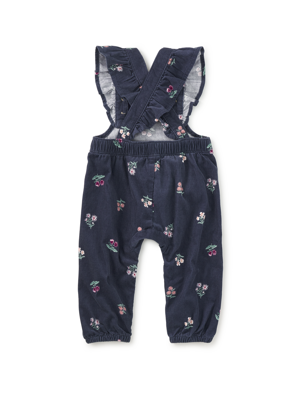 A pair of toddler girl's navy blue corduroy overall with a small pink, green, and white floral print, featuring ruffled shoulder straps and elastic cuffs.