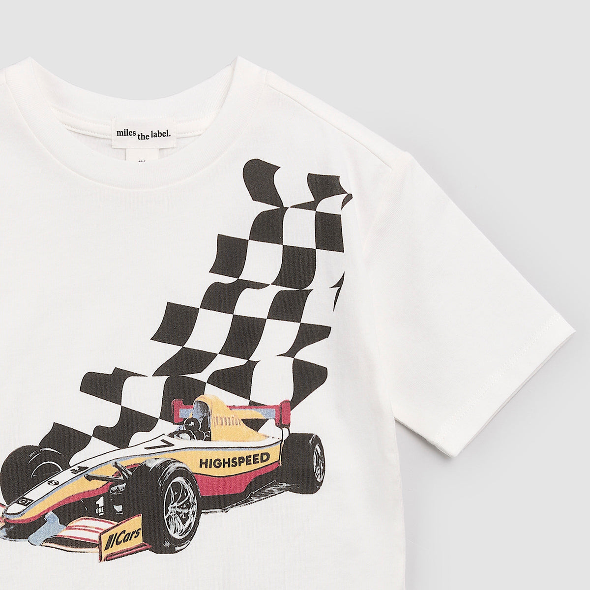 White t-shirt with a racing car and checkered flag design on a light gray background