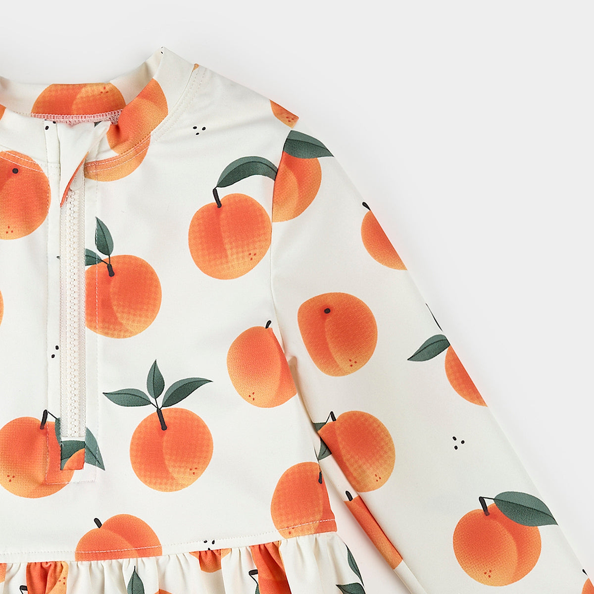 Children's raincoat with peach pattern on a white background