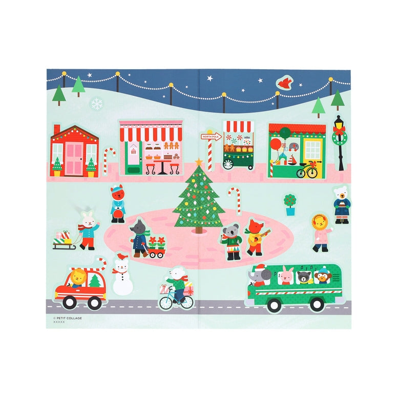 A product photo of the Christmas Town Mini Sticker Set by Petit Collage featuring a snowy winter landscape backdrop populated with various holiday-themed character, vehicle, and building stickers.