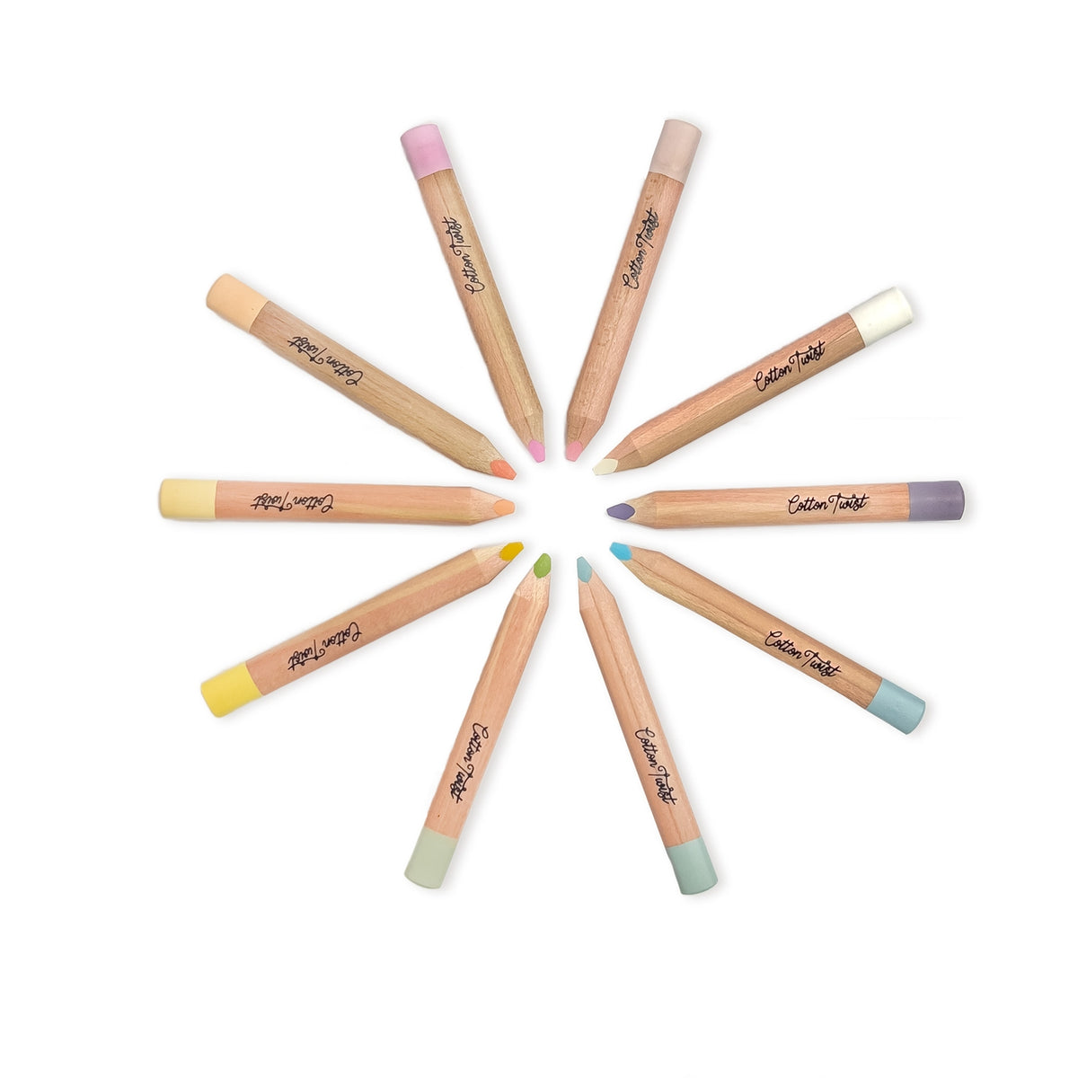 Set of makeup pencils with colorful caps arranged in a circle on a white background