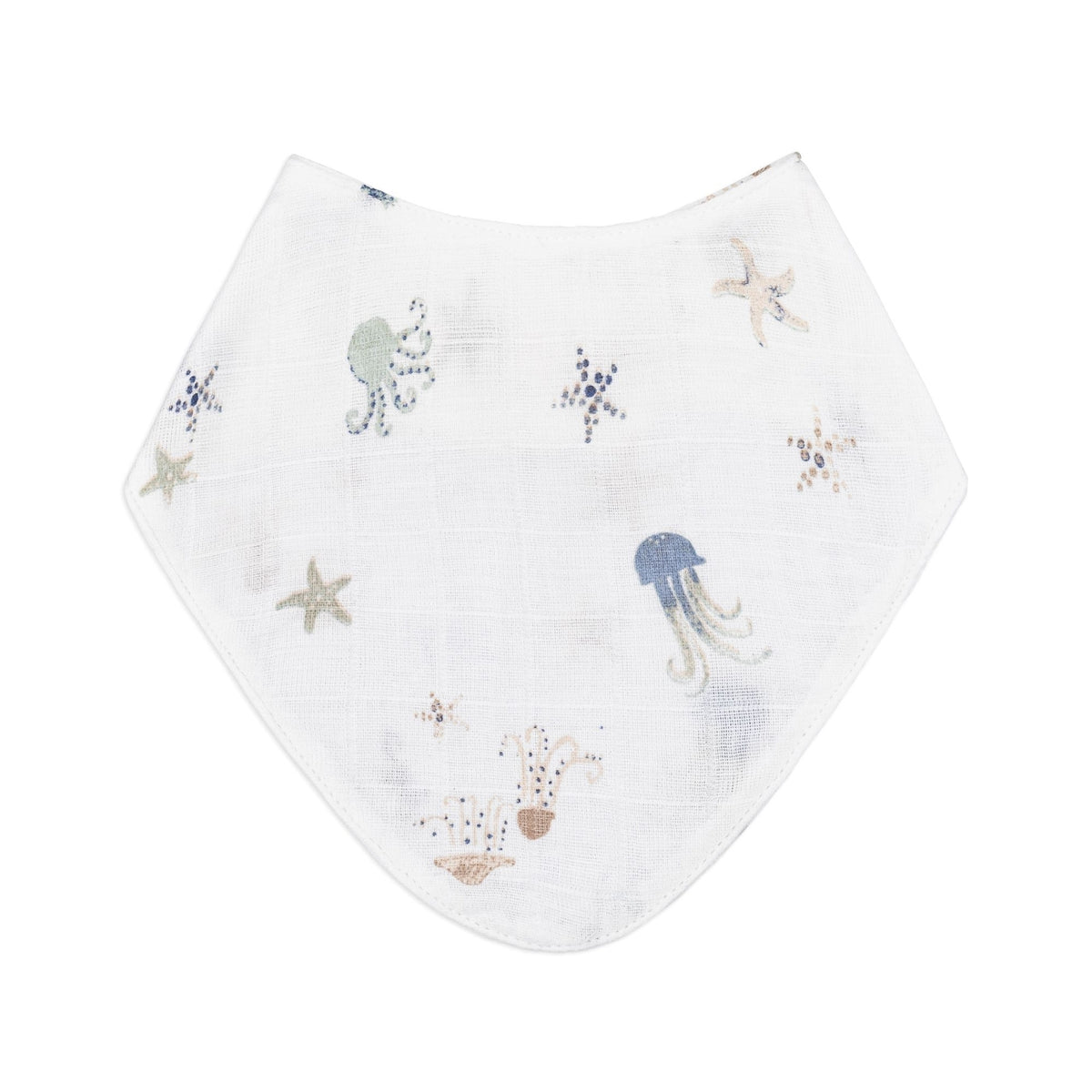 A white muslin baby bib featuring a delicate underwater print of jellyfish, starfish, and sea plants in muted blue, beige, and gray tones, shown flat against a solid white background.