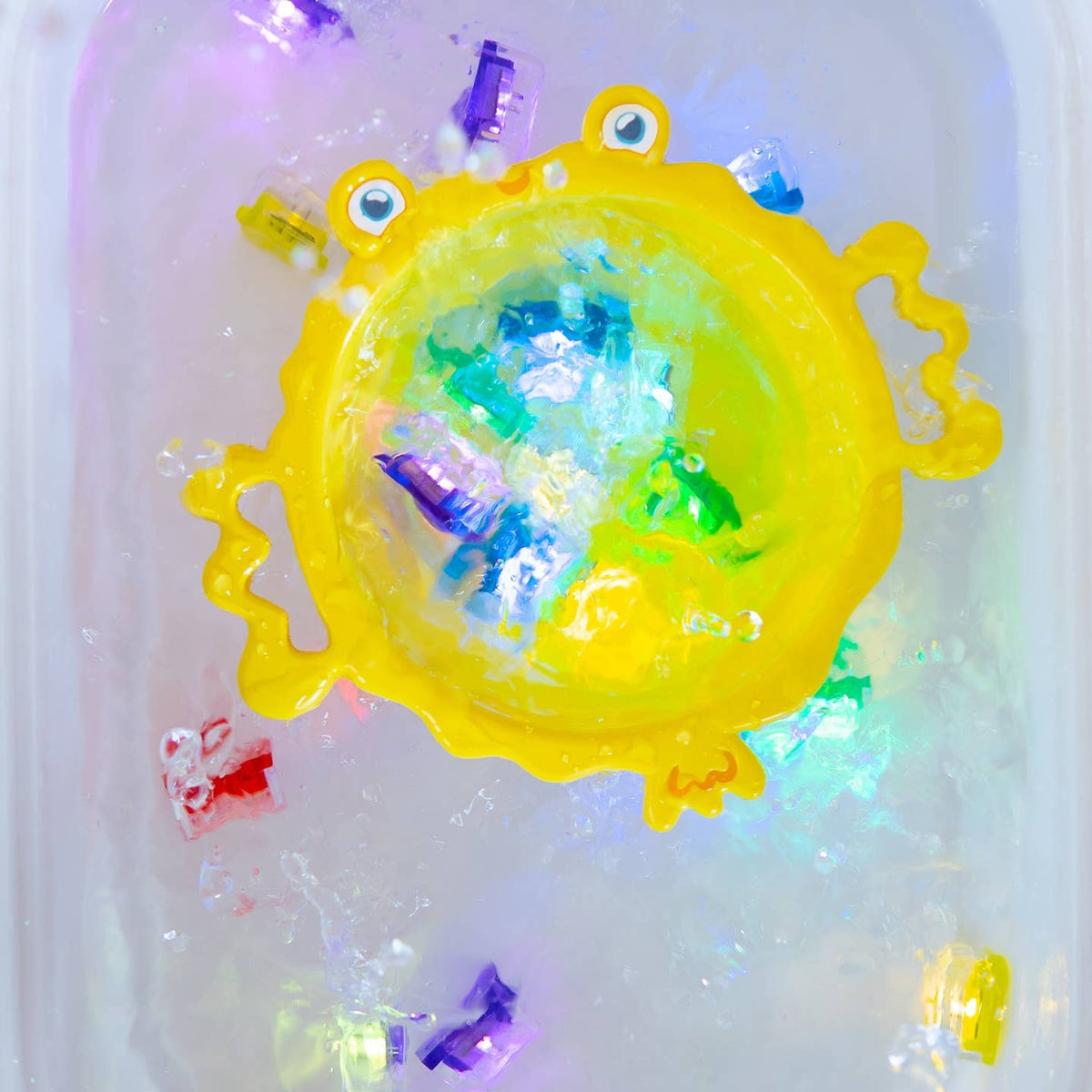 Colorful toy with a yellow base and multicolored accents on a white background