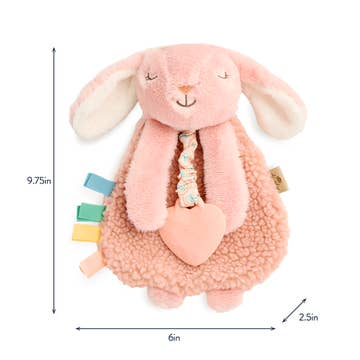 Pink plush bunny toy with a heart and colorful tags, shown with measurements on a white background.