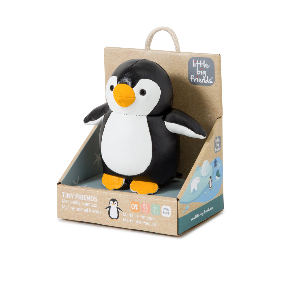 Penguin toy in a cardboard packaging with 'Little Big Friends' branding.