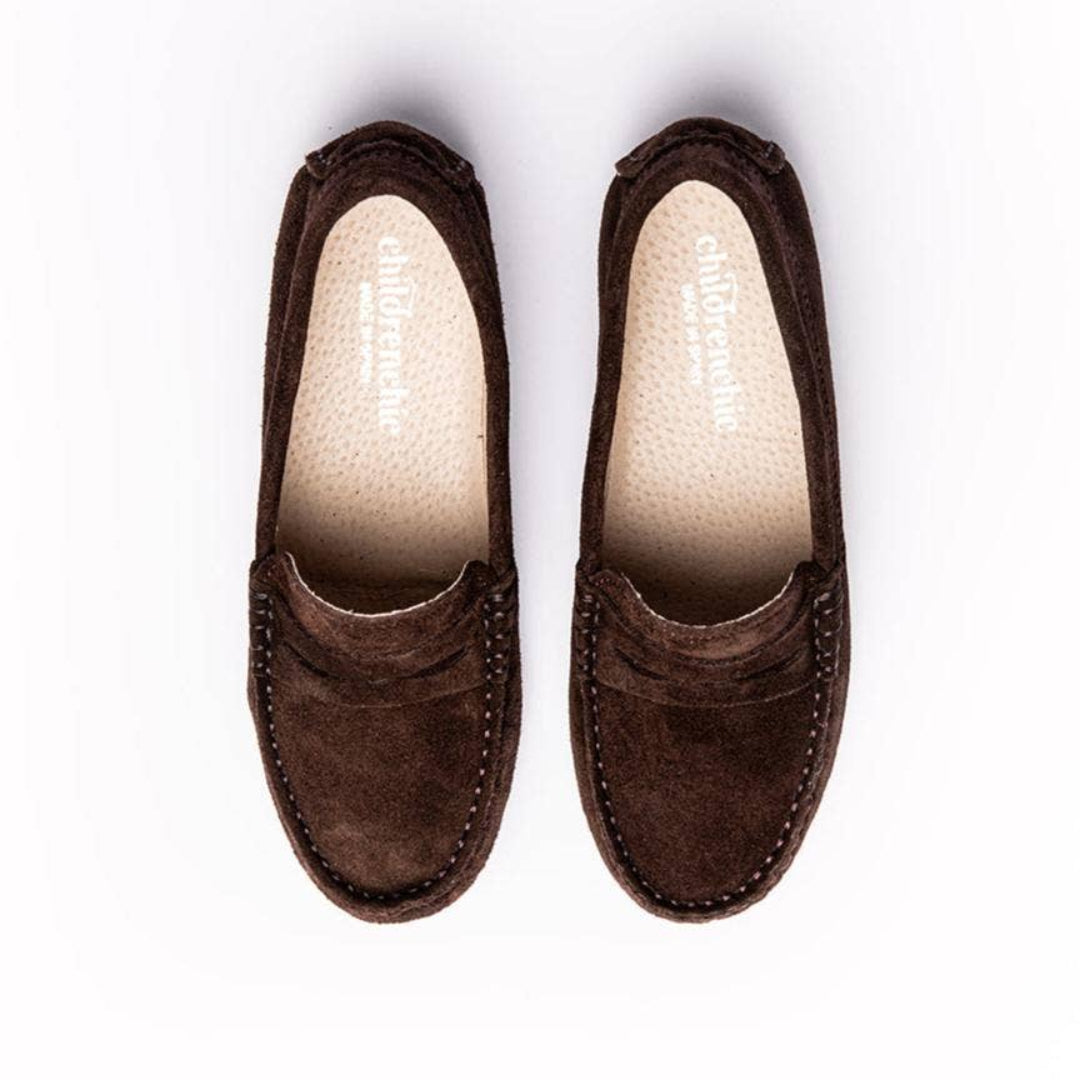 Pair of brown loafers on a white background